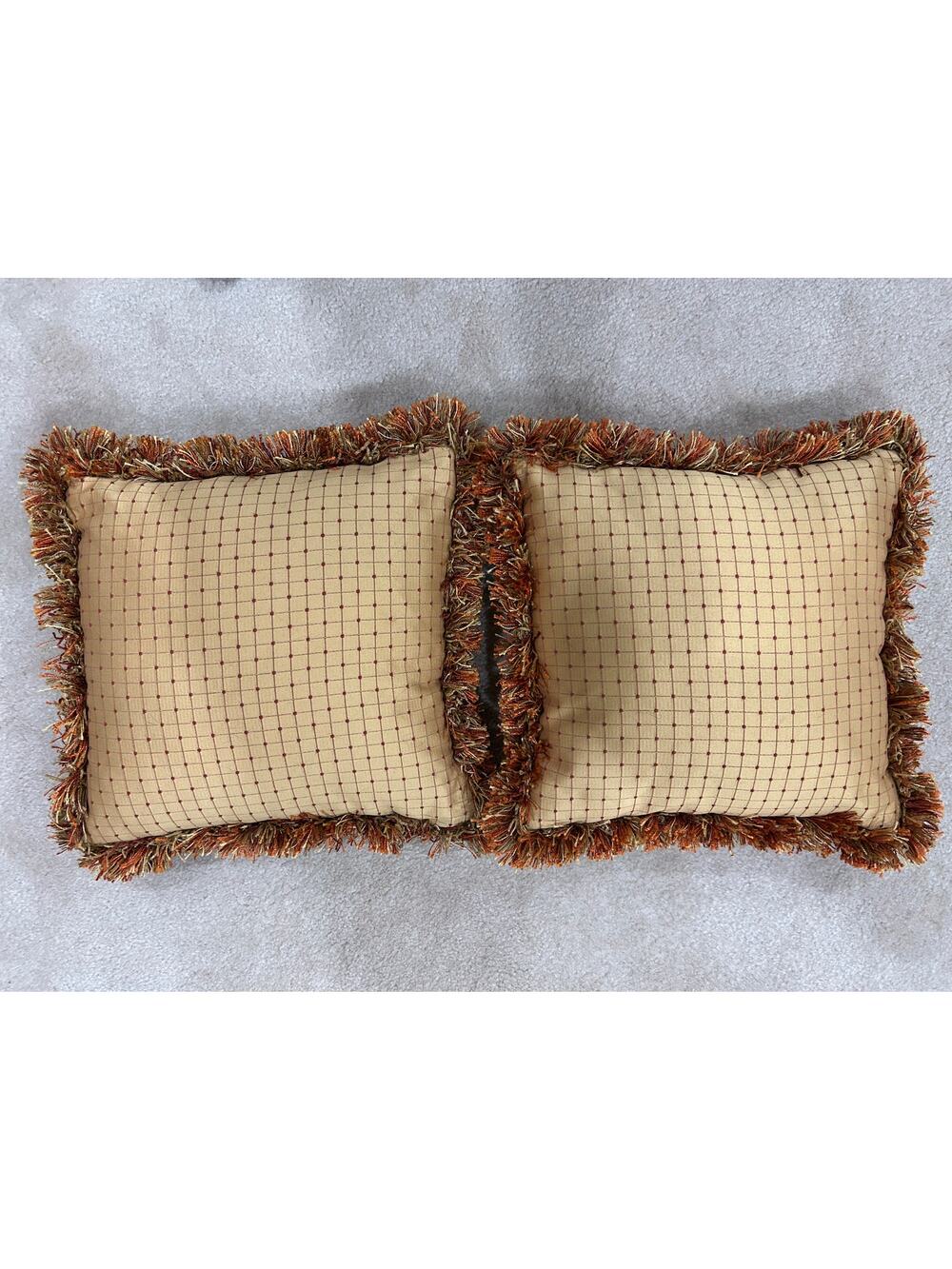 Pair of grid or checkpattern throw pillows orange brown gold